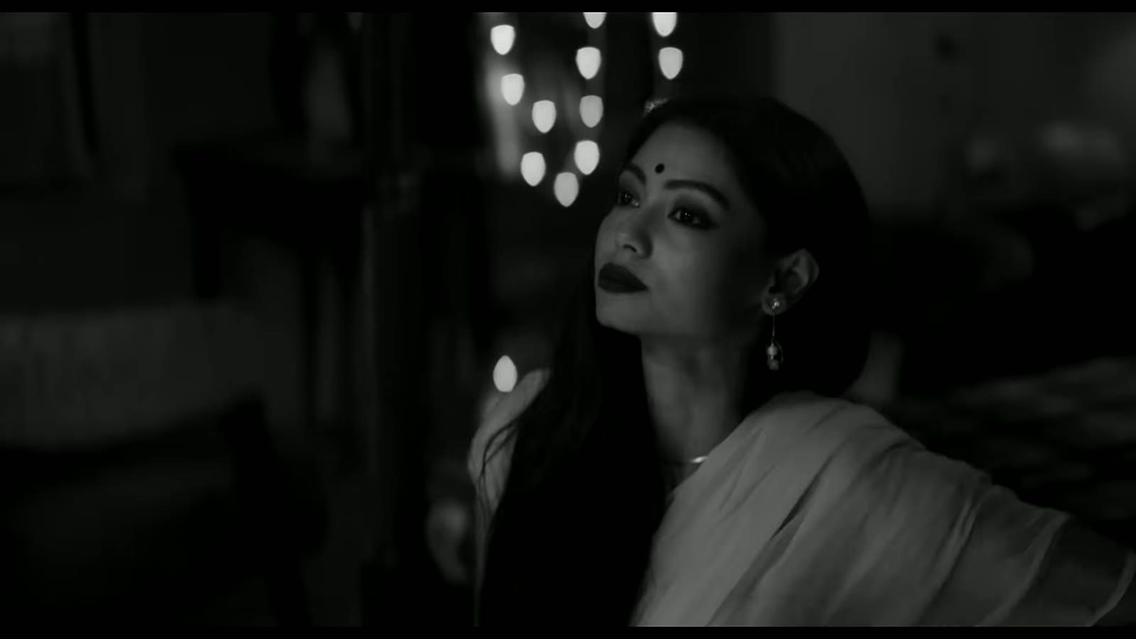 Frame from Pratibimb — a low-light interior composition shot on ARRI Alexa XT